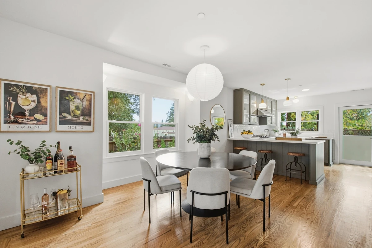 Adams Street dining area with warm wood floors and daylight