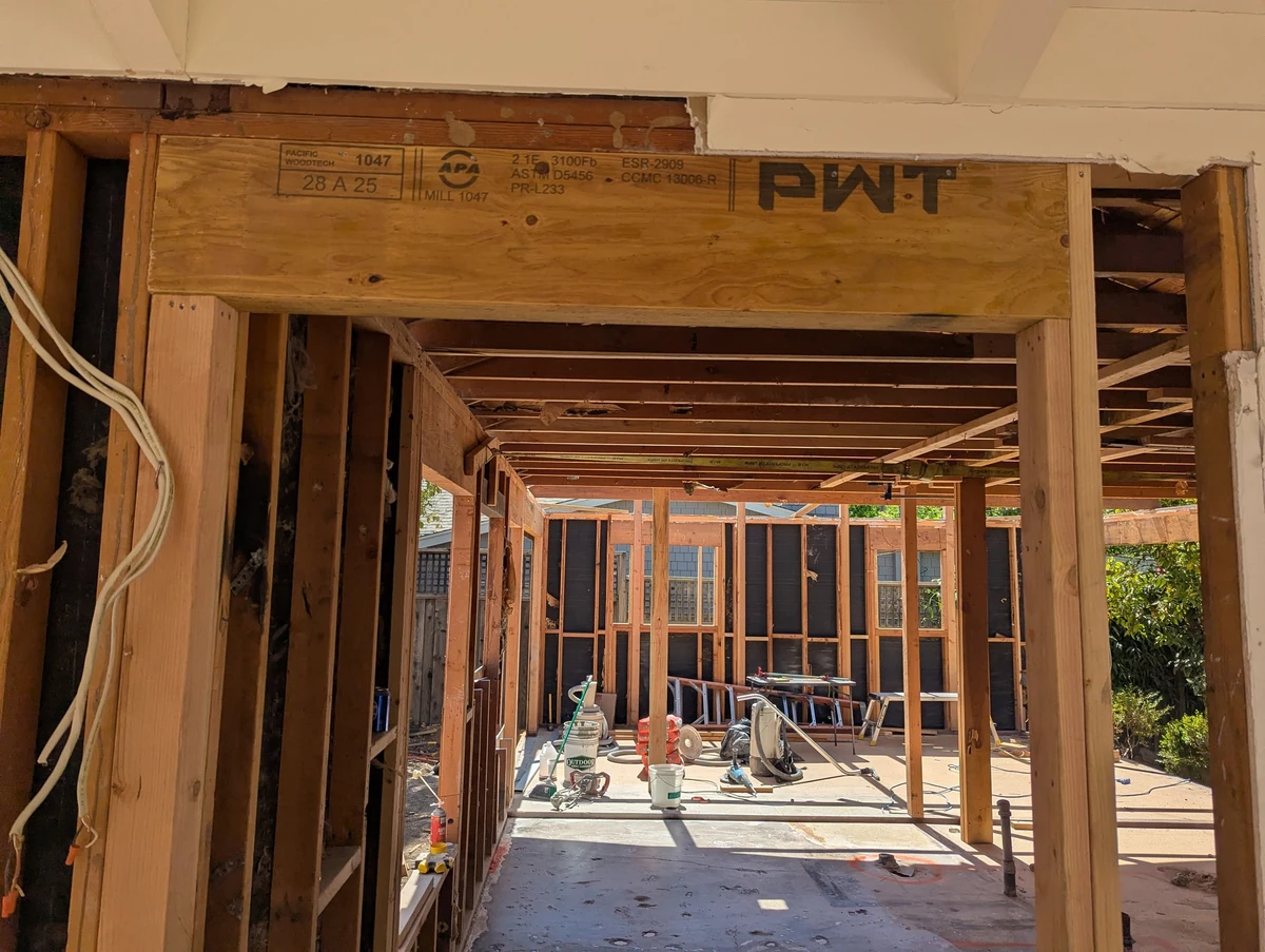 Exposed timber and roof framing during work at the Hudson Street Residence
